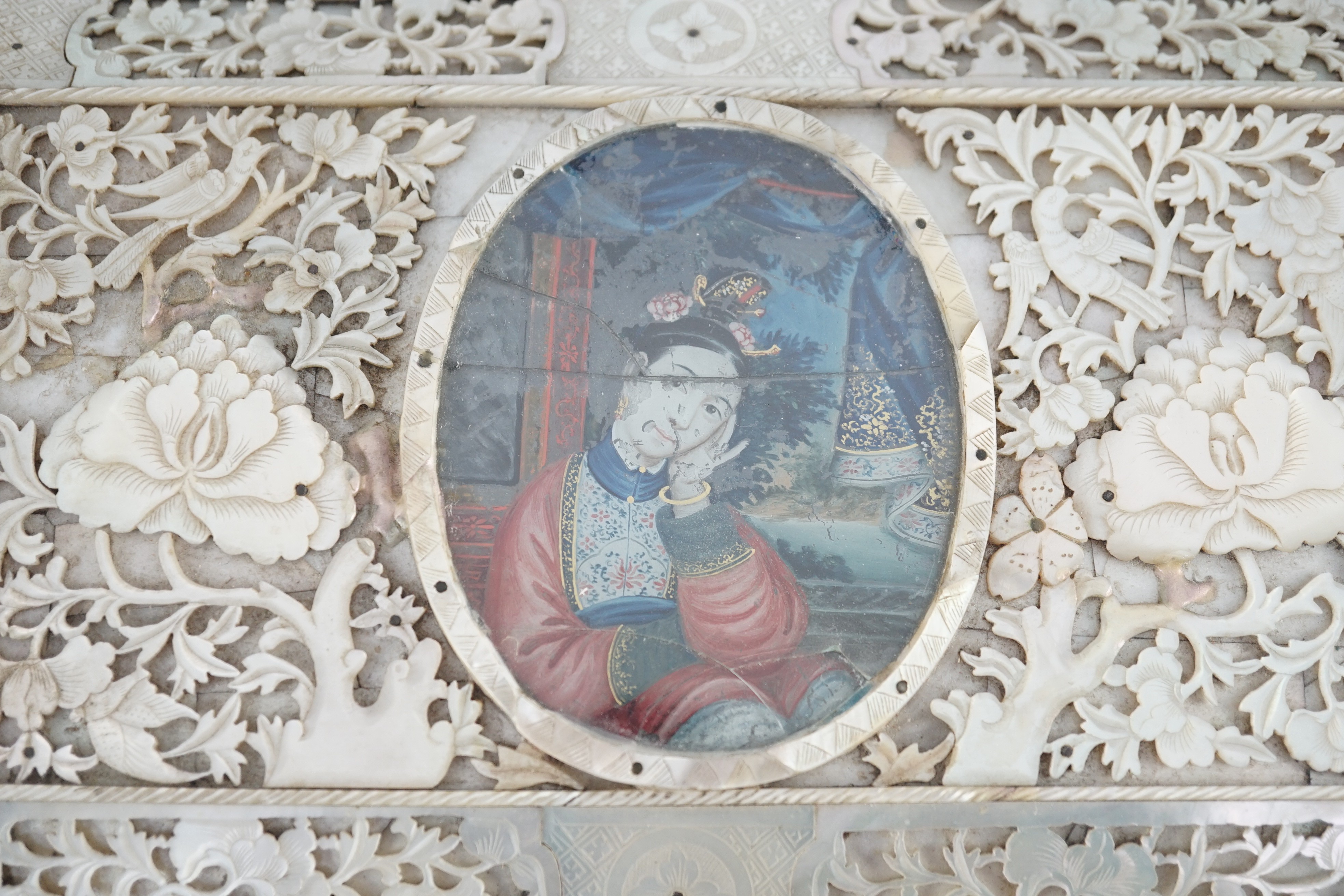 A rare Chinese export mother-of-pearl and reverse painted glass mounted casket, late 18th century, 27.5cm wide at feet, 15.5cm high, some damage